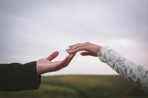 Couple photographed together outdoors